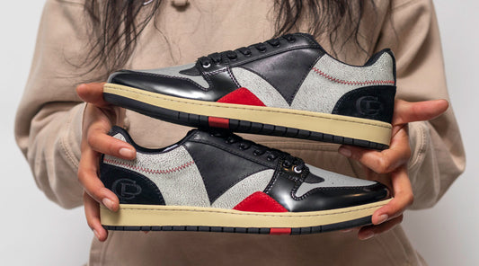 woman holding Collection Plate MANTA collection sneakers